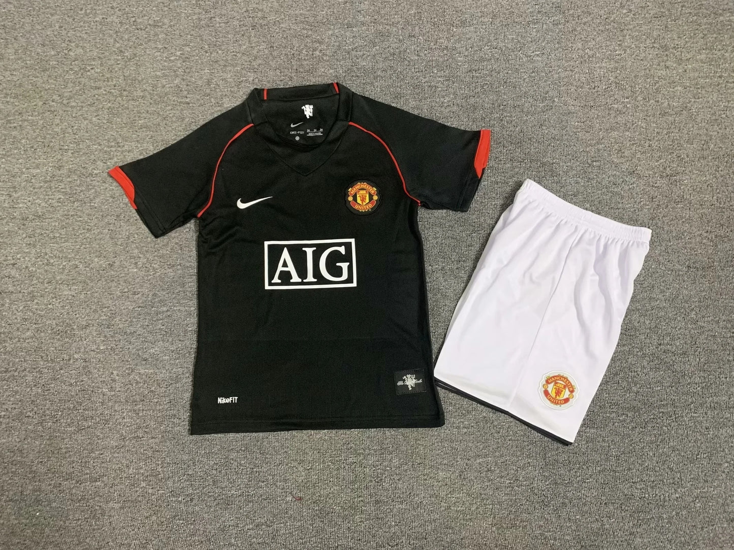 Kit niño visitante Manchester United 07/08